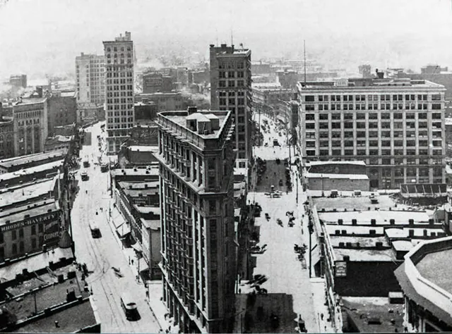 A rooftop view of Five Points looking south from the Candler Building in 1906, with the Flatiron Building and streetcars below.