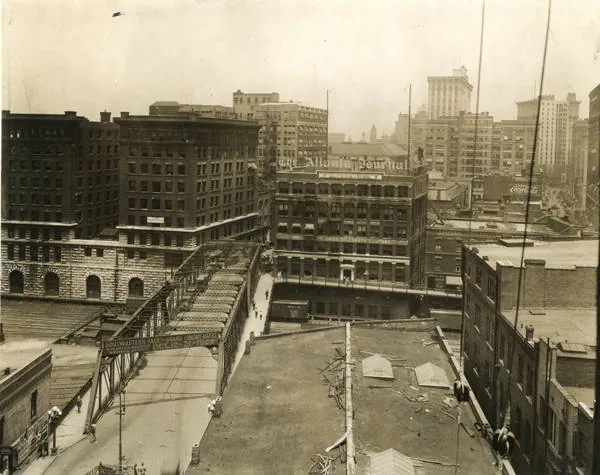 Forsyth Street looking north in 1922 from a rooftop, the viaduct works below and tall buildings on both sides.
