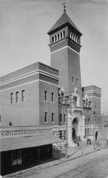 The Atlanta Police Headquarters on Decatur Street in 1895: a tall brick building with a square tower and an arched entrance.