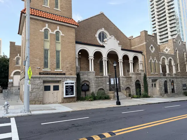 The arched porch of the church from the corner.