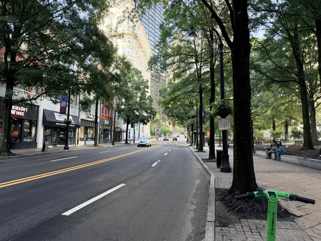 Peachtree Street looking north from Walton Street, trees along both sidewalks.