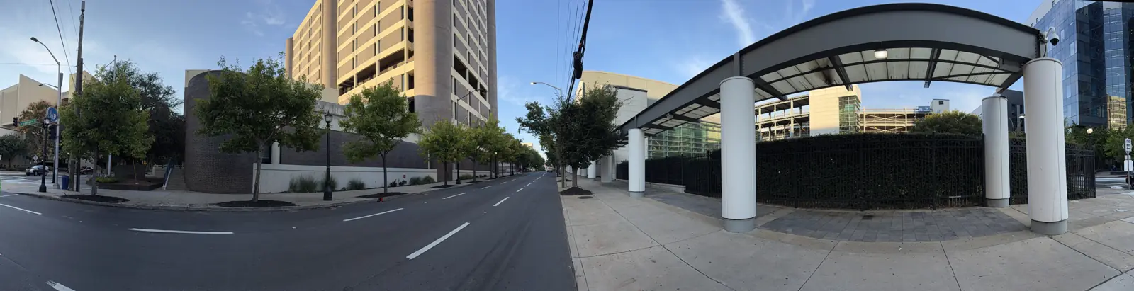 A wide view of Decatur Street at Piedmont Avenue with a covered walkway and parking decks.